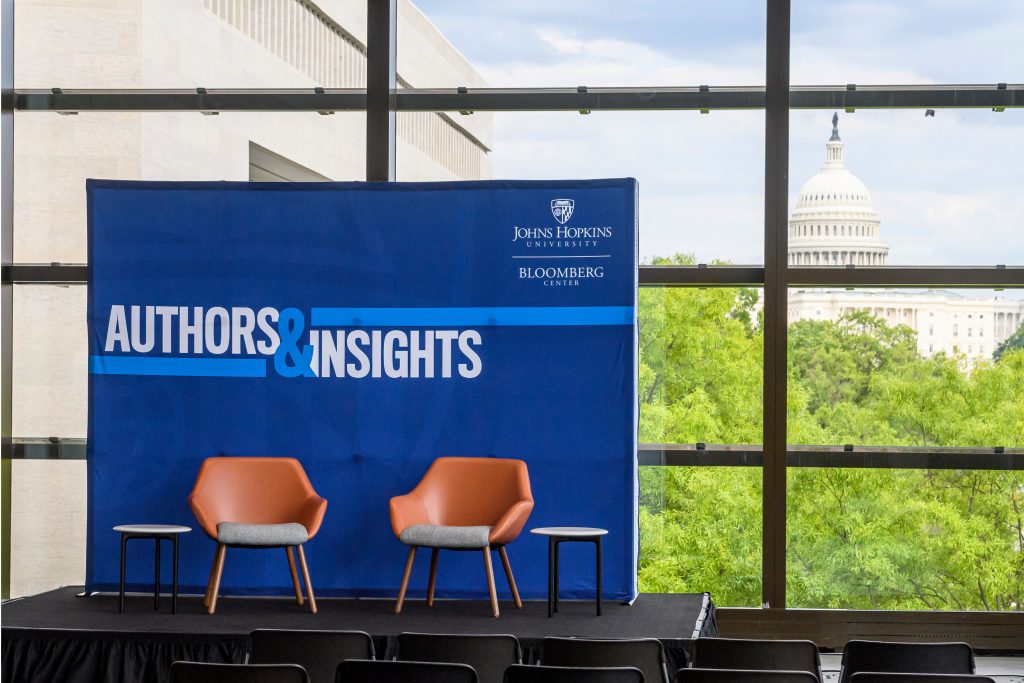 Authors and Insights backdrop featuring the Bloomberg Center lock-up