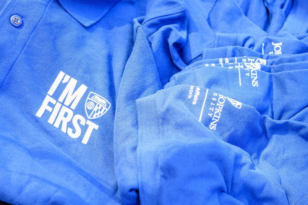 Polos with "I'm First" text and shield