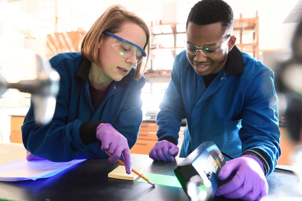 Two students working in a lab