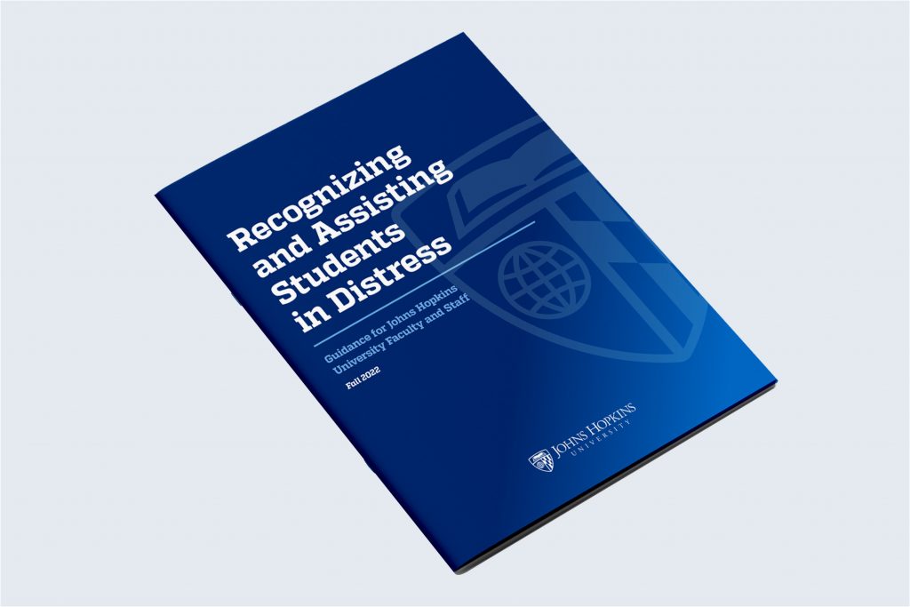 Shield as a watermark in the background of a printed report cover