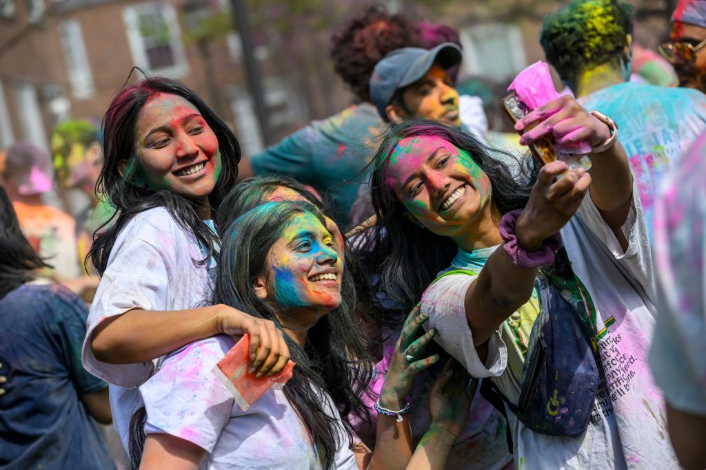 Group of students taking a selfie at the Holi celebration