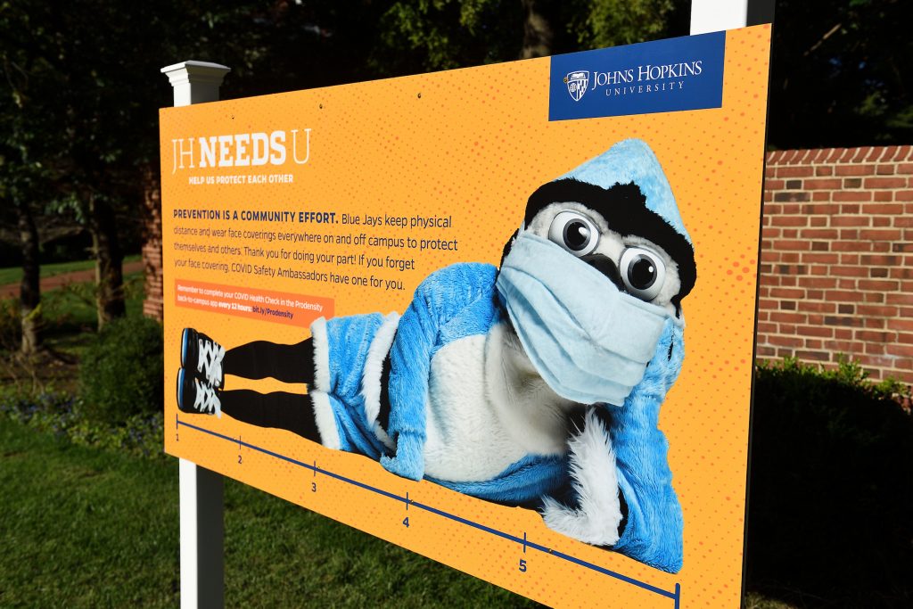 Jay mascot on a Covid sign