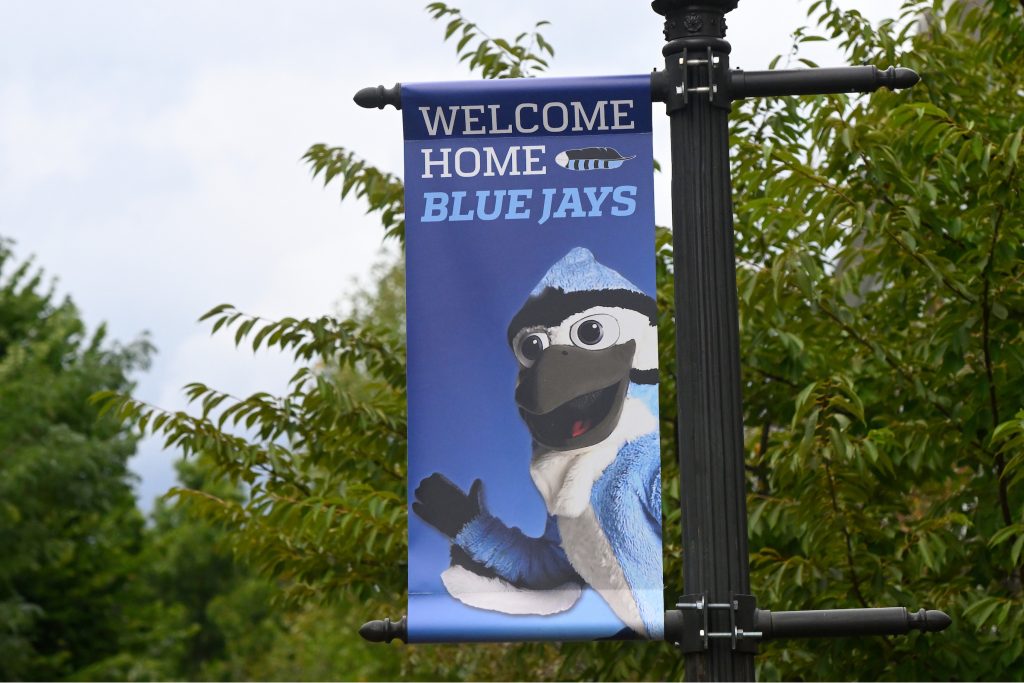 Welcome Home Blue Jays light pole banner featuring mascot image