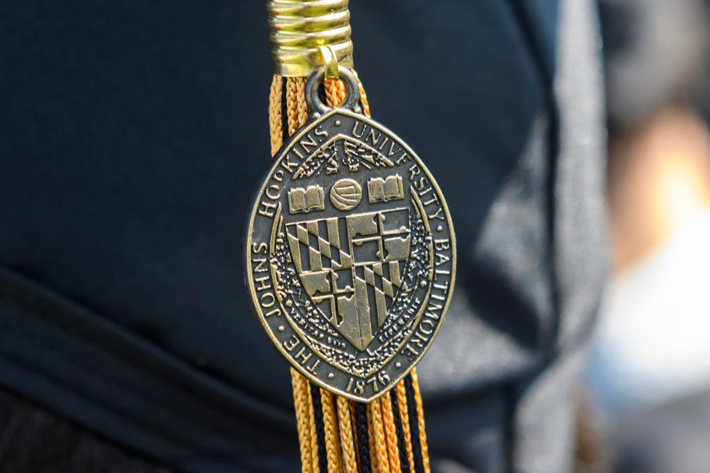 University seal on graduation tassle.