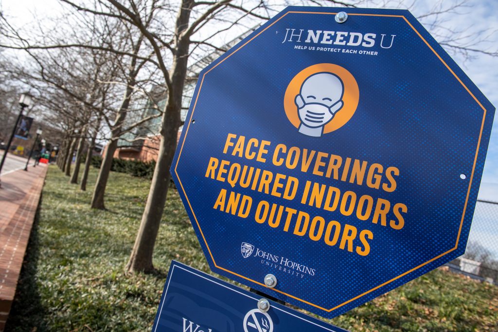 JHneedsU outdoor sign promoting face coverings