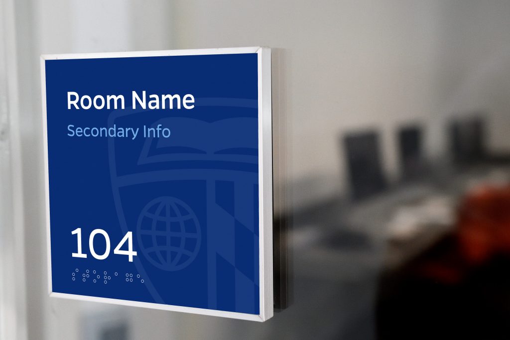 Room sign with number, brail, and room name