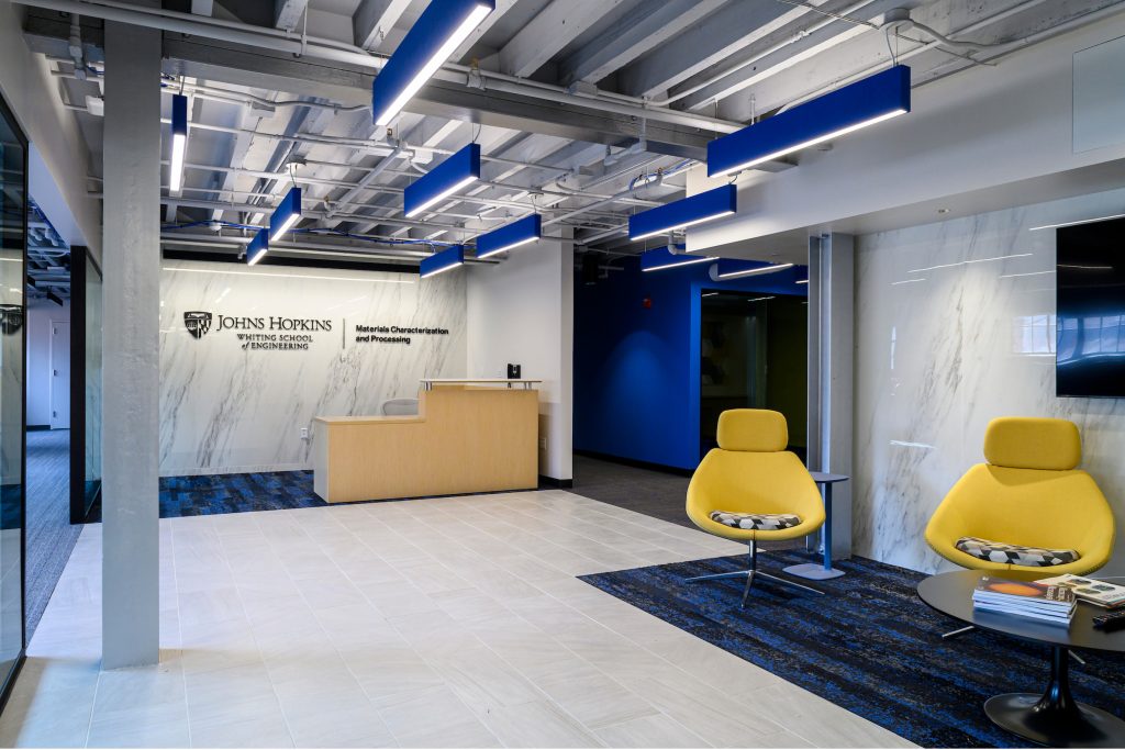 Reception area featuring accent chairs and unit lock-up on wall