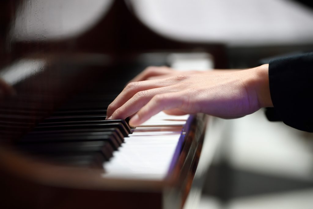 Hands playing piano